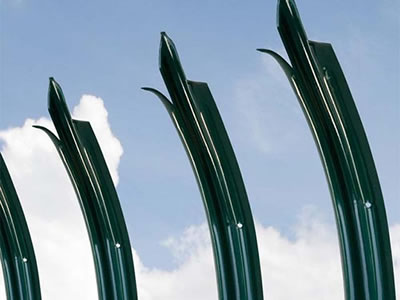 Three green powder coated triple pointed palisade pales with bent top.